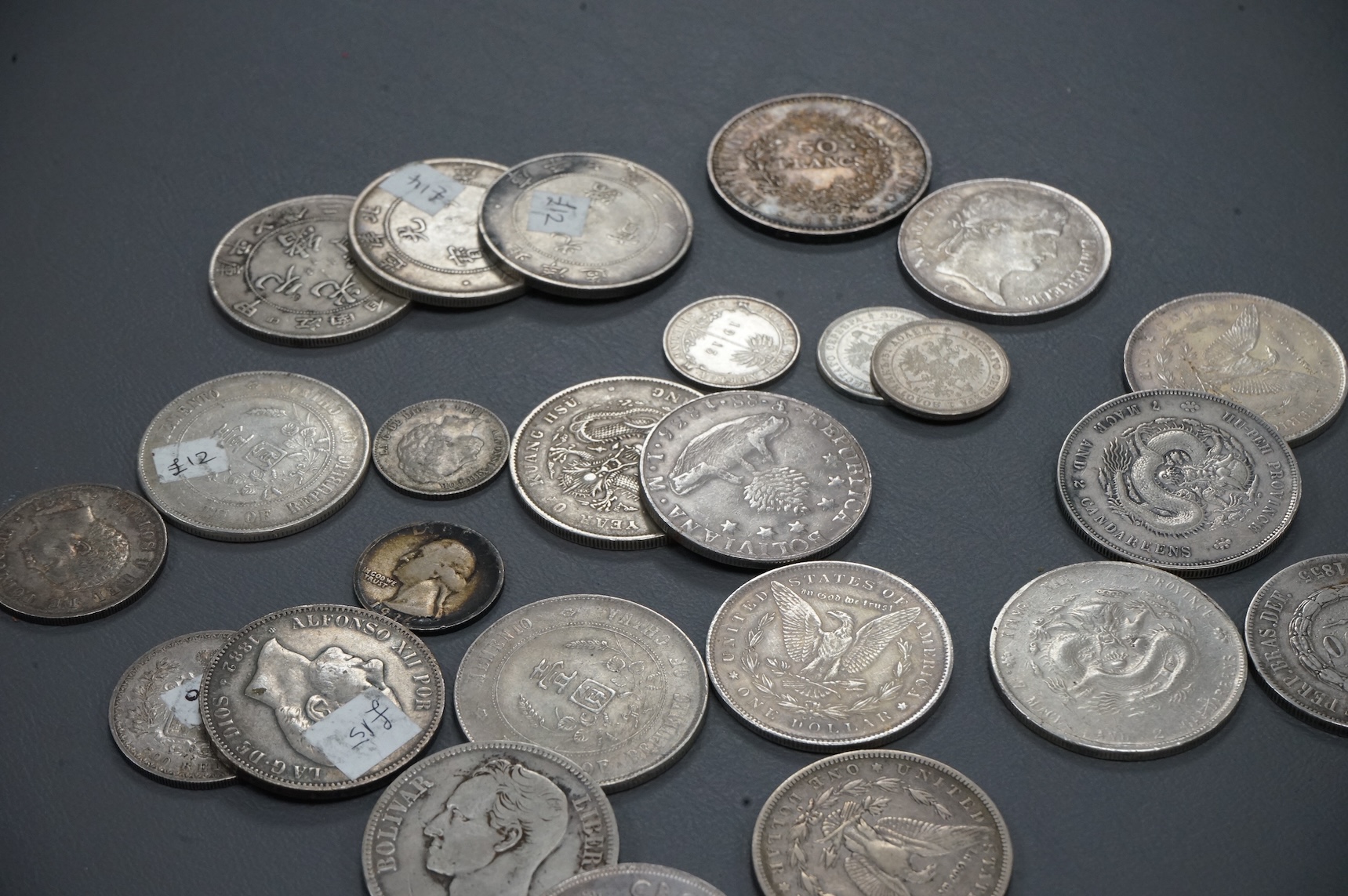 A collection of Chinese, France, Italy silver and coins and other world silver coins, late 19th/20th century